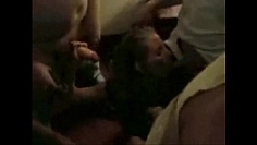Nice girl giving a blowjob at a party